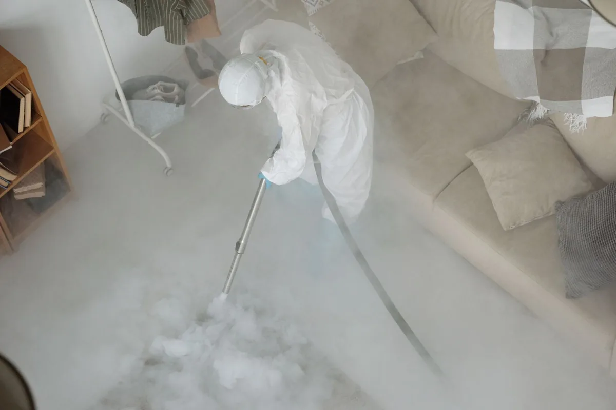 Biohazard cleanup technician in protective equipment, Crestwood, MO